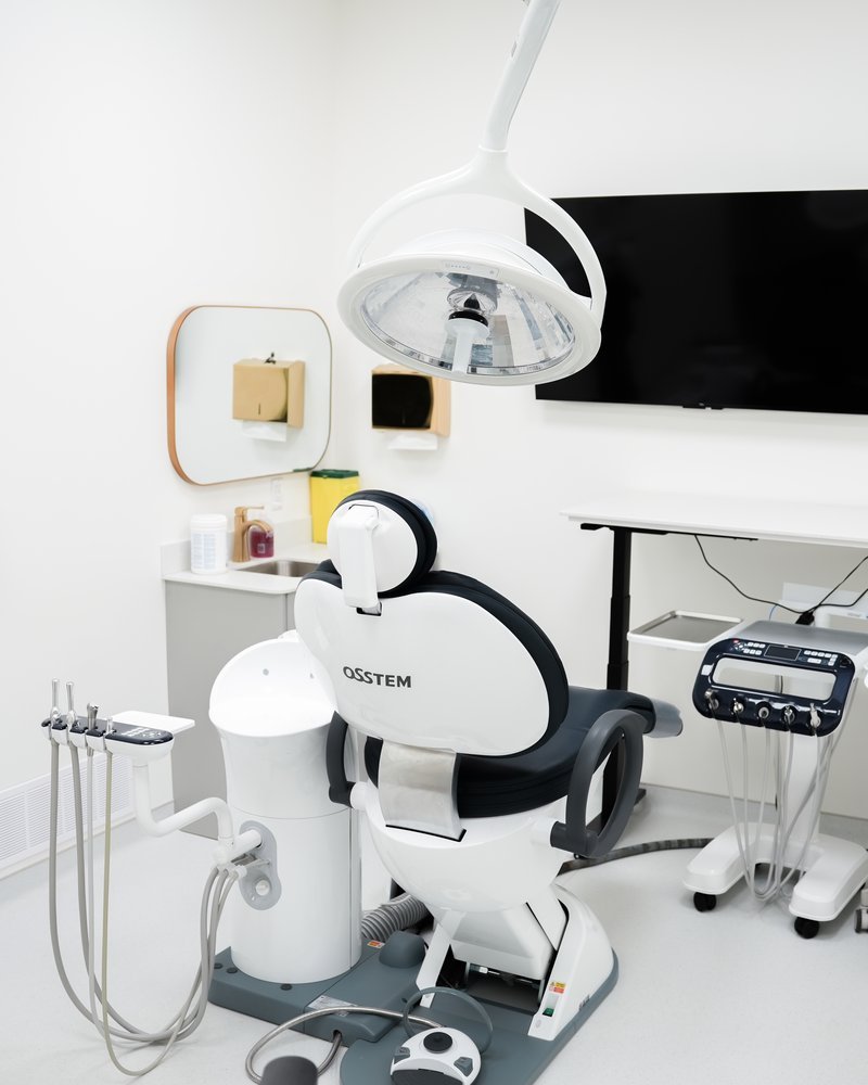 A dentist at Suncoast Dental explaining treatment options to a patient